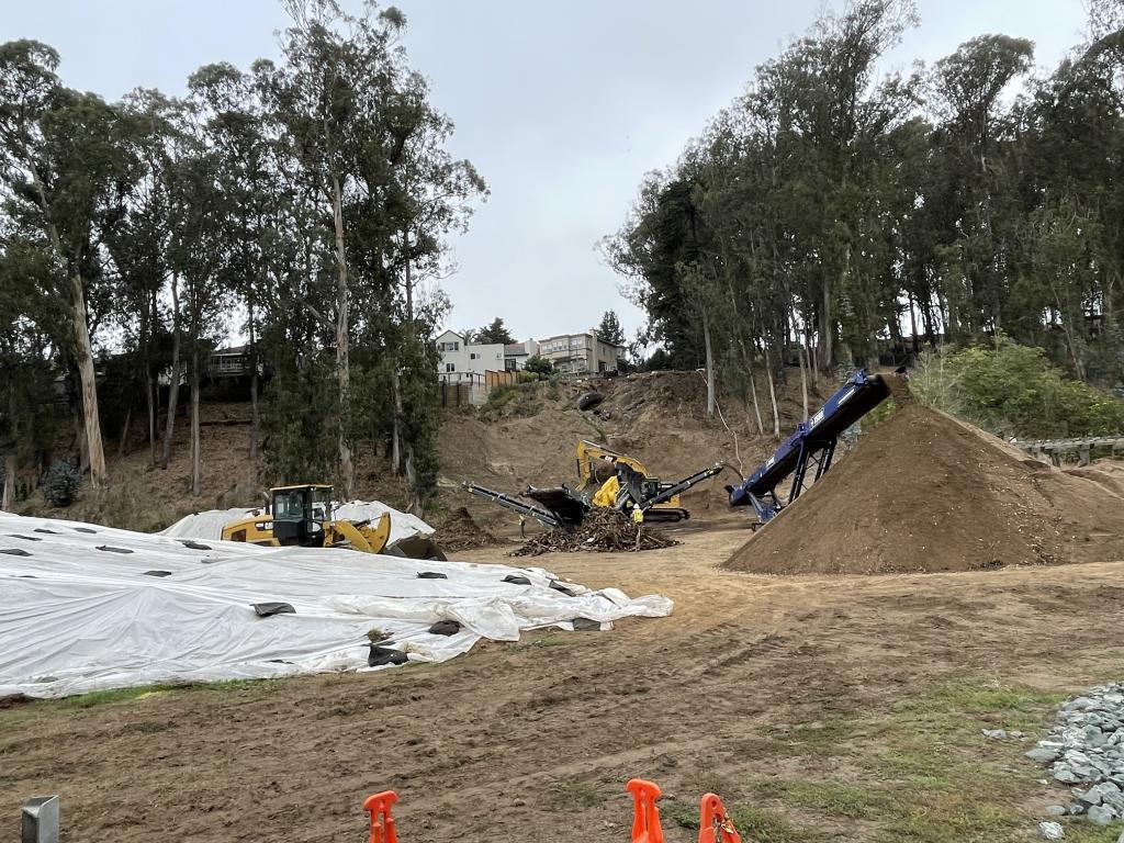 Machines "grubbing" the surface of the slide area