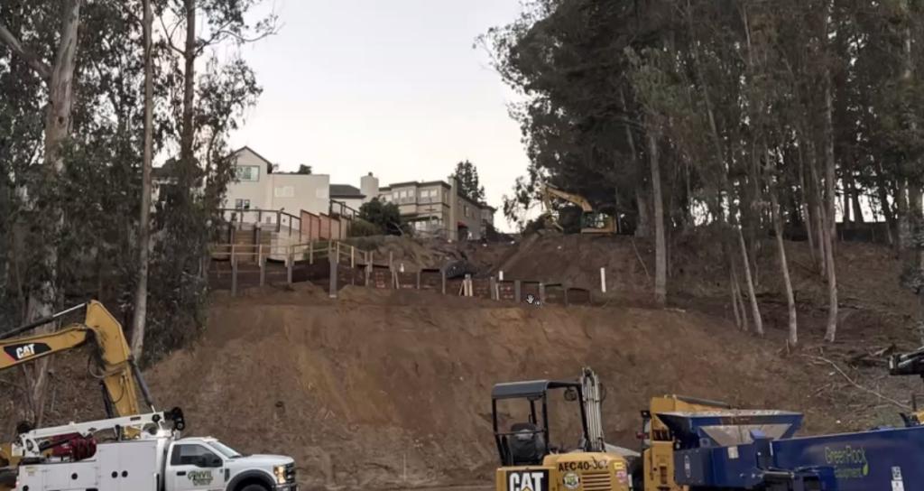 Photo shows exposed retaining wall which will later be covered over 