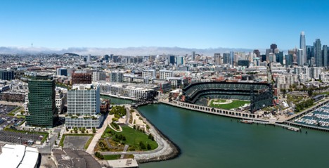 Aerial photo of McCovey Cove with city skyline and Oracle Park on right side, China Basin on the left side.