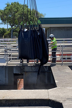 Replacing the anthracite coal filter media in one of the underdrains at Harry Tracy Water Treatment Plant.