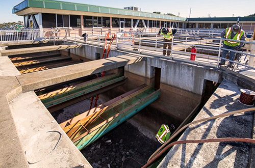 Demolishing the plastic underdrains at Harry Tracy Water Treatment Plant.