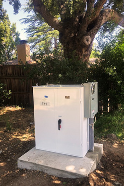 After the metal rode is drilled deep underground next to the water pipeline, all that is left to be seen is a rectifier cabinet.