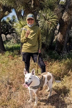 Hiker Alex Stecher and his dog Apollo.  Photo courtesy of East Bay Regional Park District. 