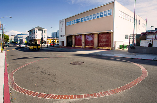 Look for brick circles in San Francisco's intersections, which mark an underground cistern. (This one is outside a fire station in the Mission.)