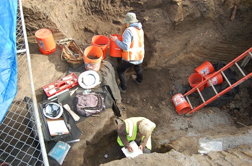 archaeologists excavating the hearth