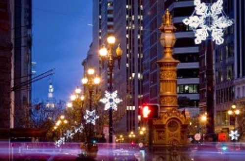 snowflake styled lights hanging along Market Street