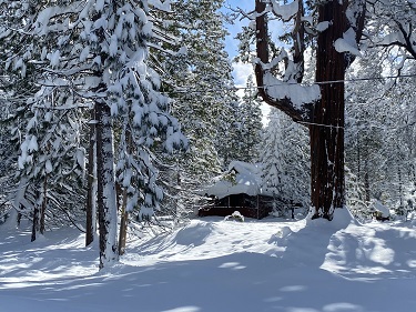 snow on buildings in Camp Mather