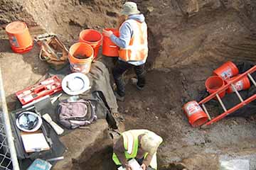 Workers excavating at a construction site.