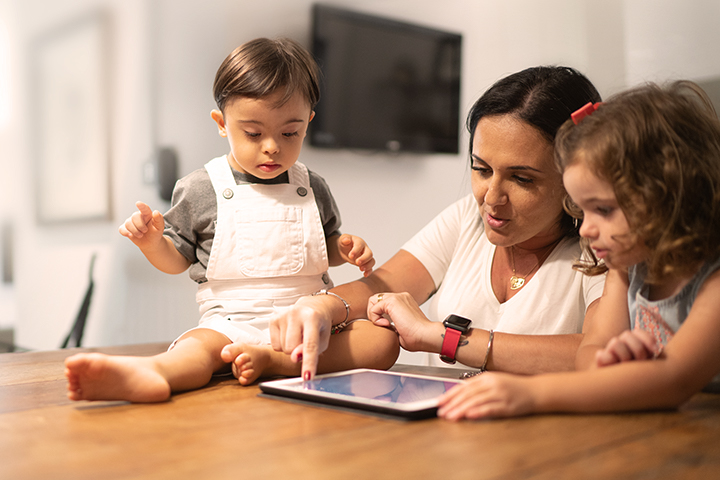 mother and two children at a table