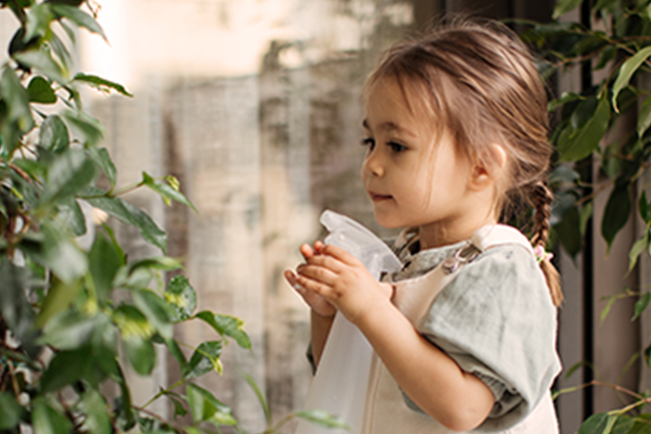 toddler holding a water bottle