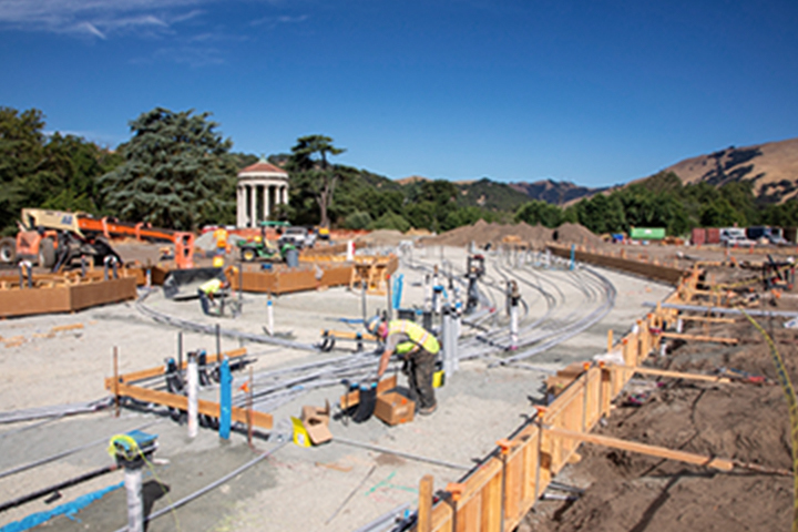 image of construction site with the Sunol water temple in the background