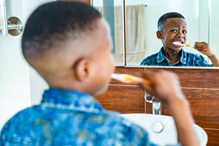 Young boy brushing his teeth.