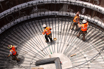 workers framing a water tank