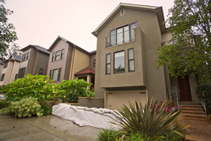 home with sandbags stacked in front