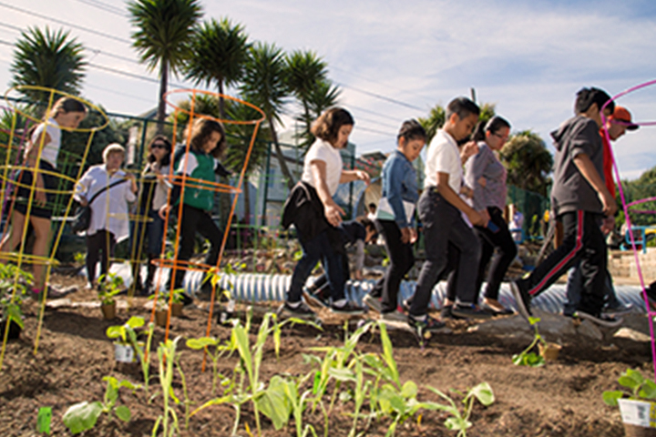 group of students entering the garden