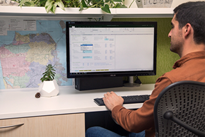 a man sitting at his desk working on a plan