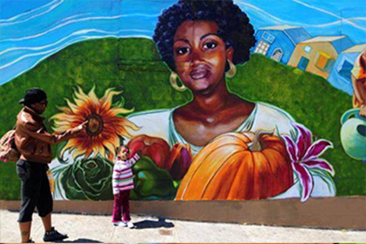 Community members with mural