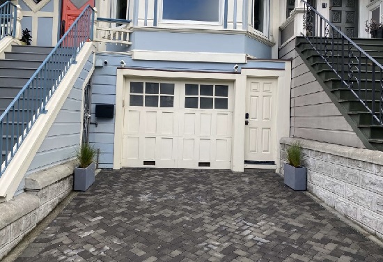 front of home garage with permeable driveway