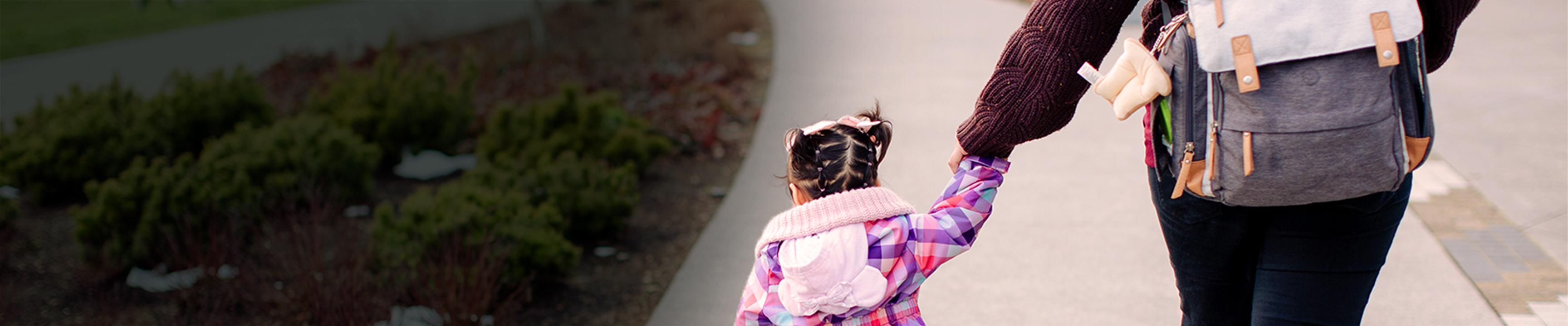 Mother and daughter walking together