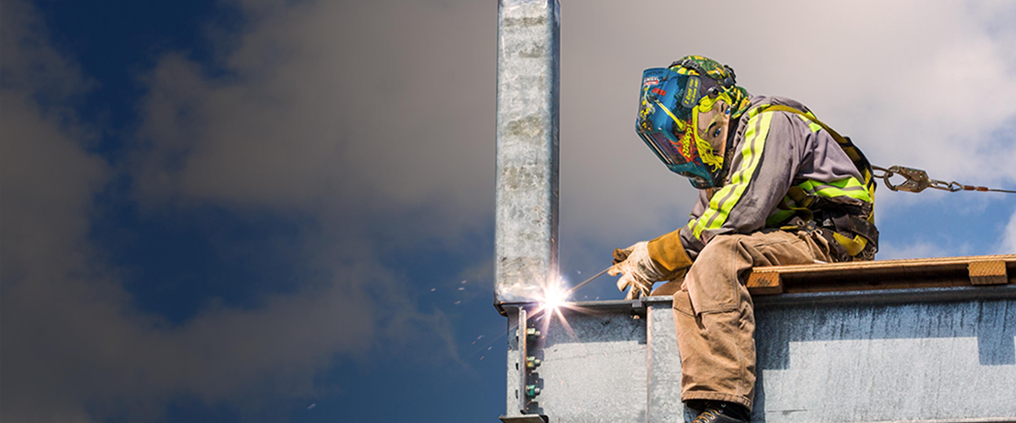 staff welding an i-beam