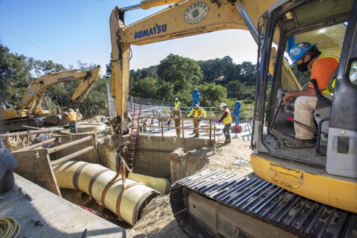 lowering section of pipeline into trench