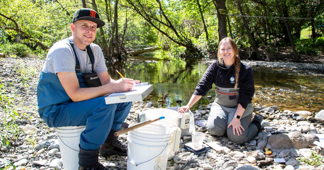 SFPUC Biologists Randy Renn and Claire Hyde record information about steelhead before releasing them back into Alameda Creek.