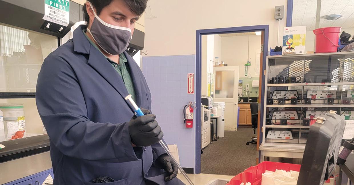 Tim Paez working in a lab.