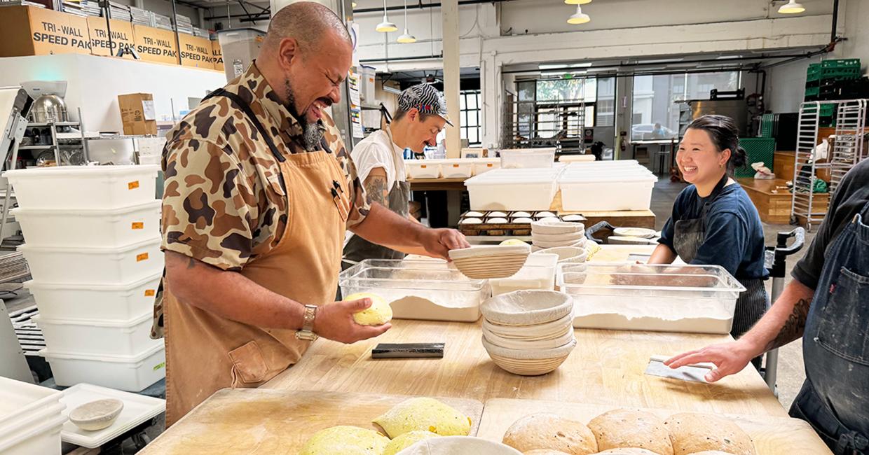 Azikiwee Anderson or Z and his staff all smiles while making bread.