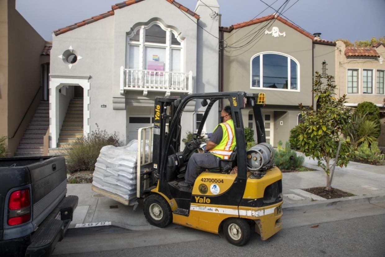 forklift delivering sandbags