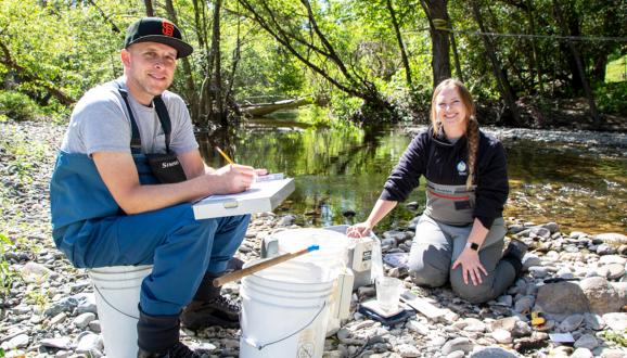 SFPUC Biologists Randy Renn and Claire Hyde record information about steelhead before releasing them back into Alameda Creek.