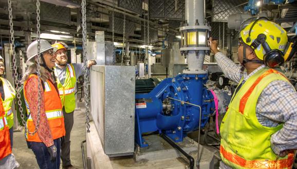 Jignesh Desai, Headworks Project Manager, highlighted the grit pump gallery in Area 45, during a recent tour with SFPUC Commission President Kate Stacy. The clear view window shows the grit particles that are being pumped to next step of grit washing process.