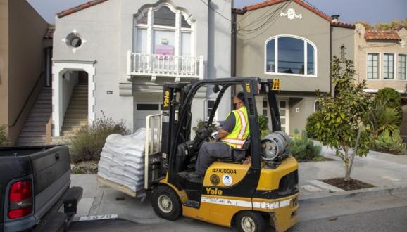 forklift delivering sandbags